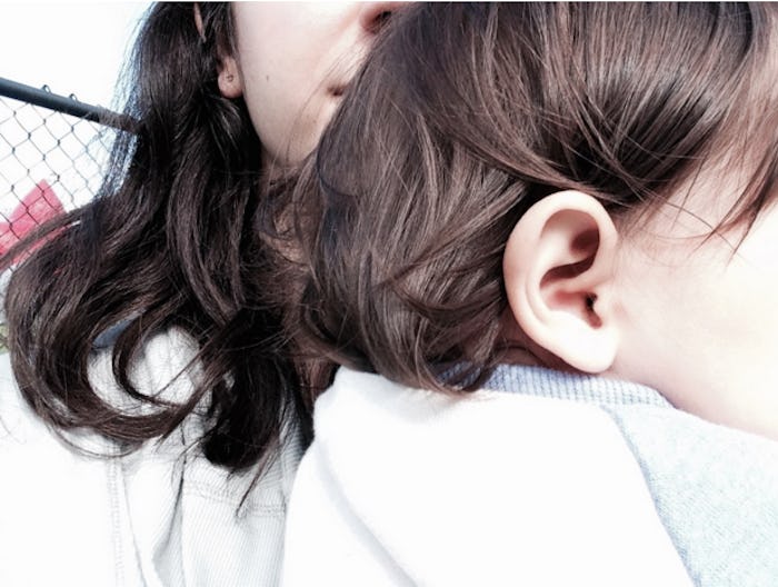 A woman holding a baby