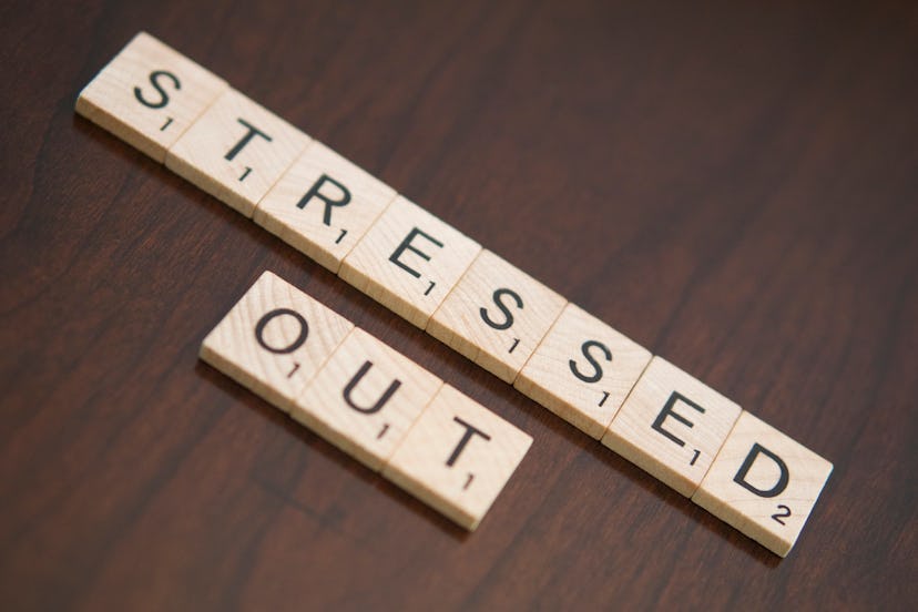 A scrabble tiles reading: 'stressed out.'