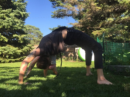 Joelle Barron doing pelvic floor yoga in her backyard.