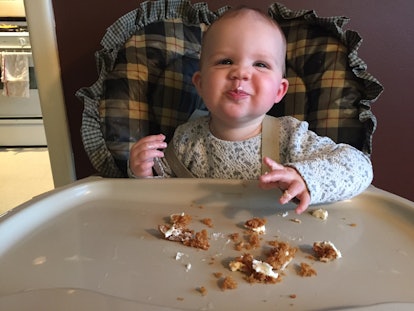 A toddler eating during a Thanksgiving dinner 