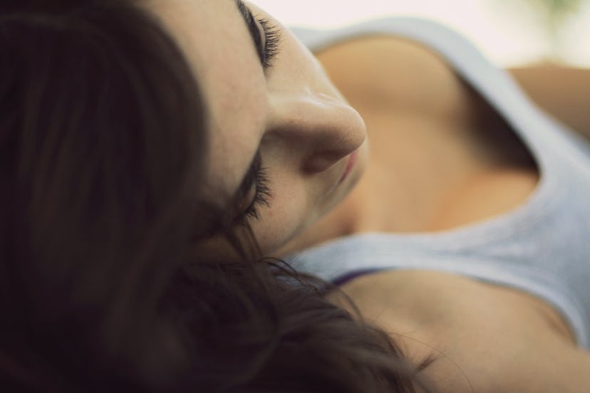 A woman lying with ArtNaturals argan oil hair mask on her hair