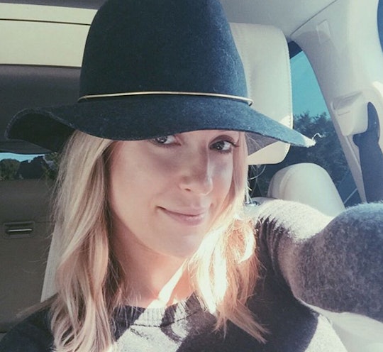 Kristin Cavallari taking a selfie in a black hat