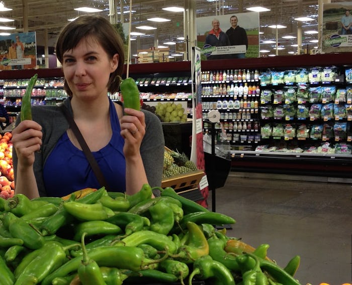 Kelly Gardiner in a supermarket holding two green peppers she hid in her toddler's meals