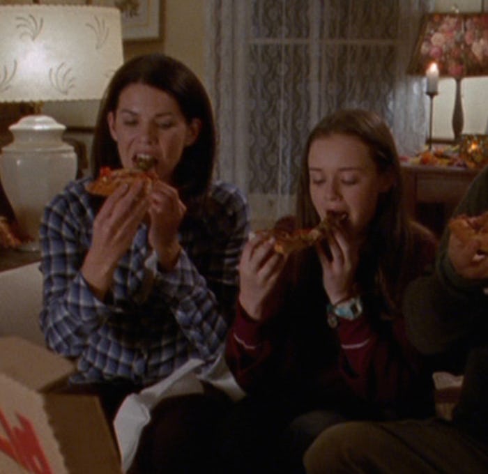 Lorelai and Rory from 'Gilmore Girls', hanging out together and eating pizza