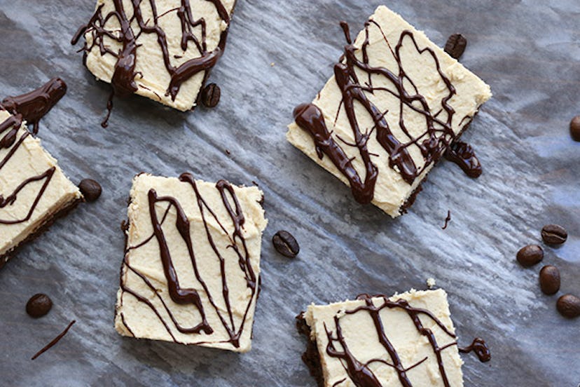 Double Espresso Brownies with coffee beans spread across a marble board