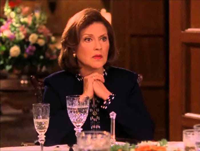 Jessica Walter sitting at a table on the set of Arrested Development