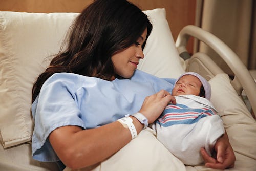 Jane from "Jane The Virgin" in a hospital bed with her newborn baby