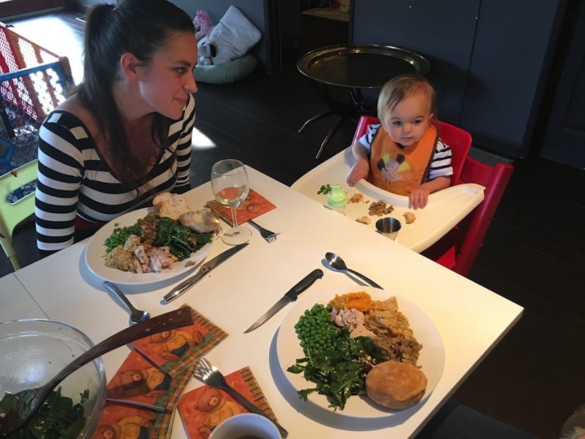 A mother having a dinner with her toddler in the restaurant