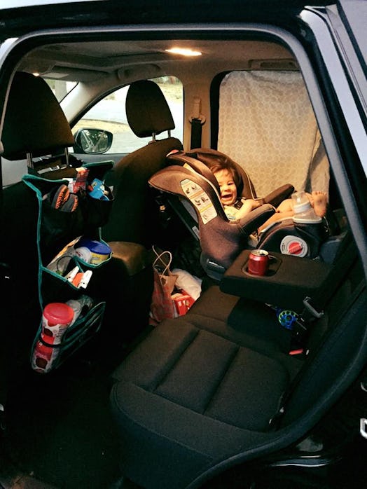 A kid sitting in a car seat