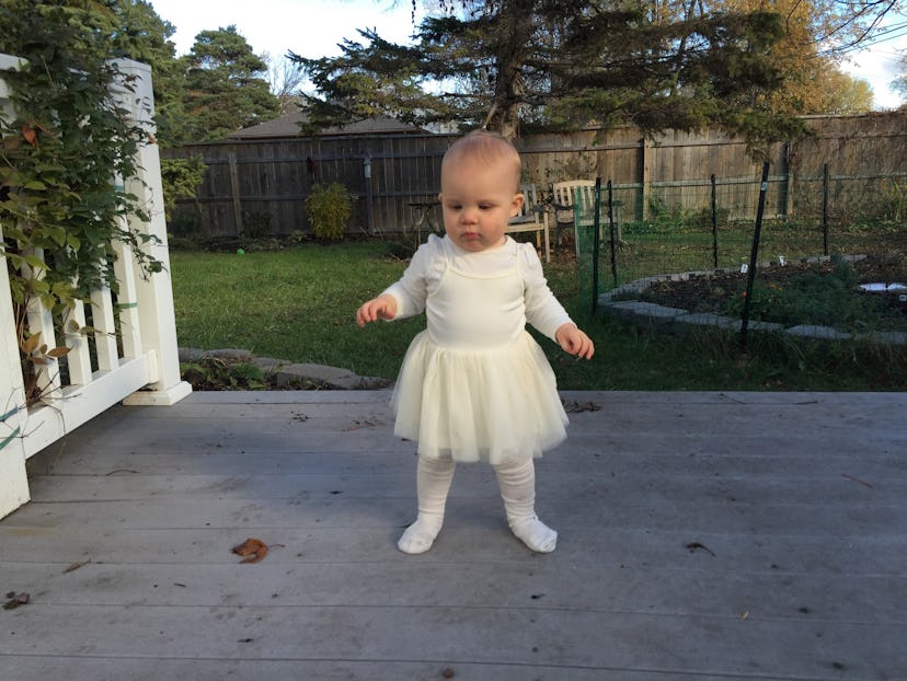 The toddler solo shot in her white ballerina dress look.