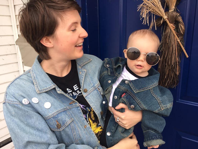 A mom and her toddler both wearing thrifted denim jackets, now the toddler wearing her sunglasses.