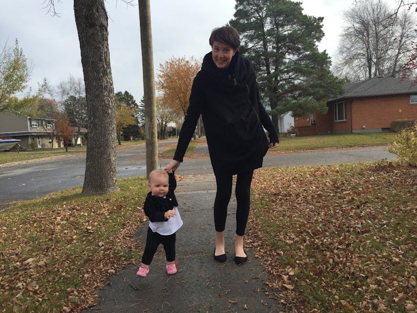 A mom and toddler wearing a black fur cape, simple shirts, leggings, and shoes.