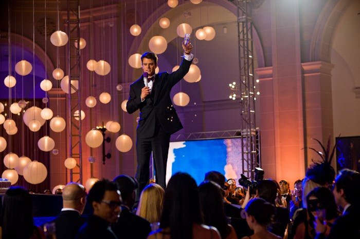 A man doing standup on stage for New Year's Eve