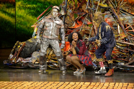Actors on stage performing in 'The Wiz Live!' as the scarecrow, tin man and Dorothy