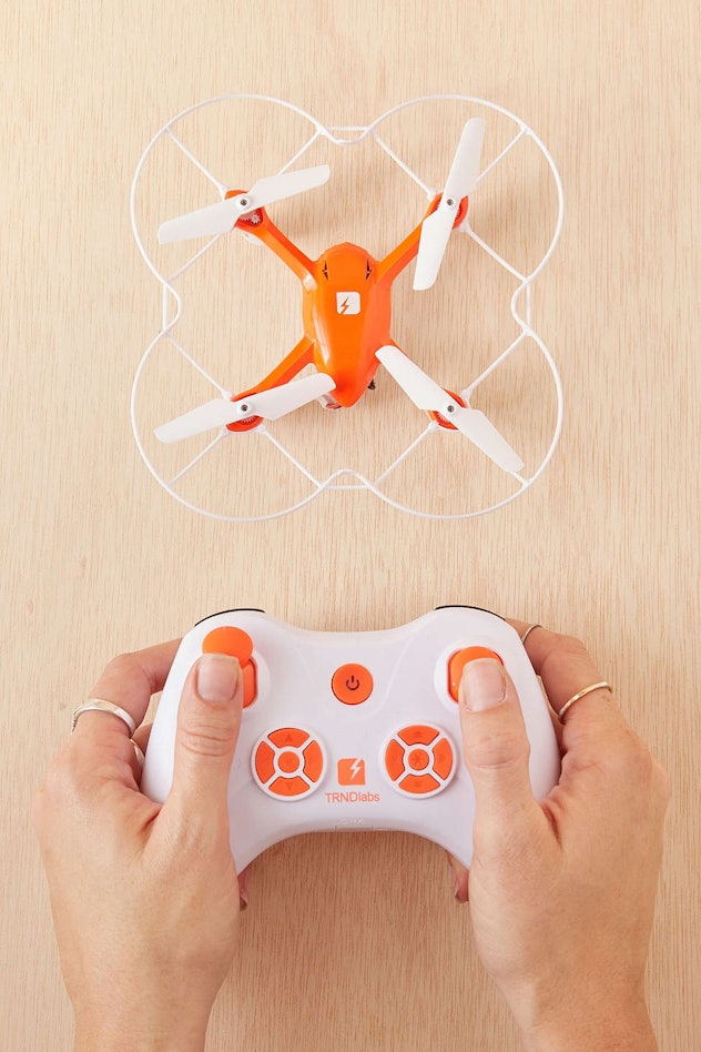 Someone playing with a mini drone quadcopter