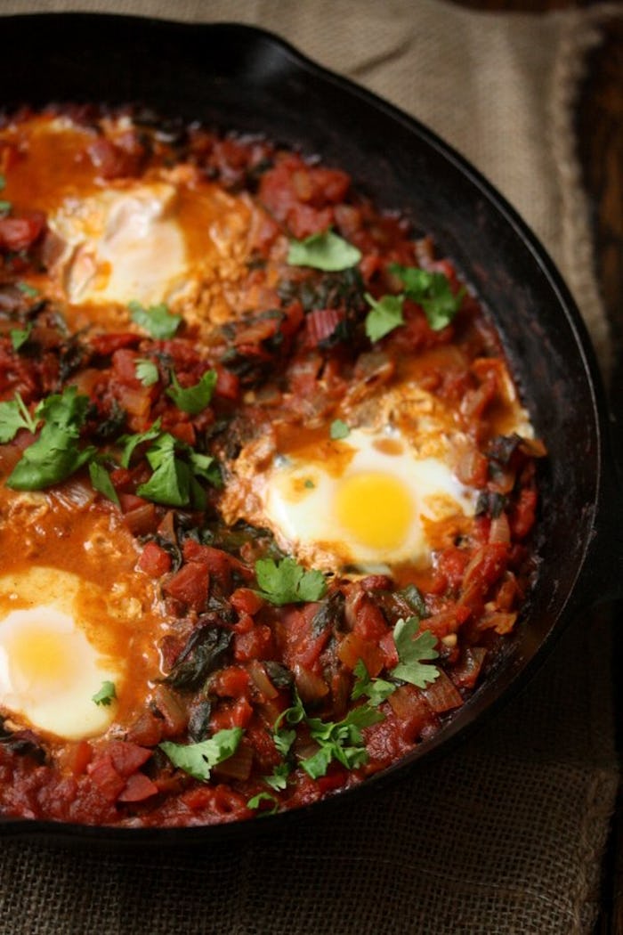 A plate with Shakshouka as one of the 9 warm breakfasts that are perfect for a snowy morning