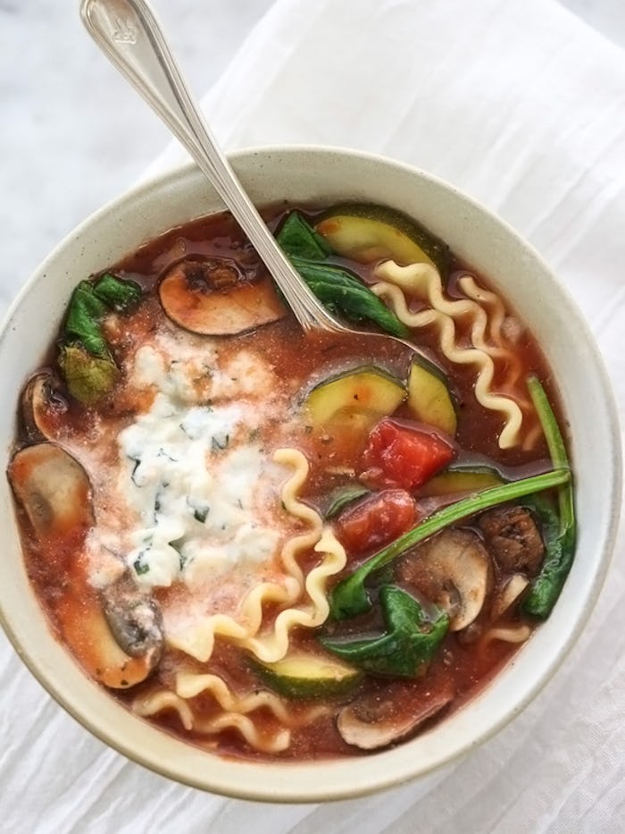 Vegetarian lasagna soup served in a bowl with a spoon