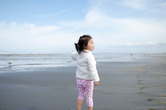 toddler girl at the beach