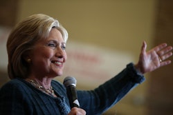 Hillary Clinton holding a microphone while speaking