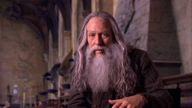 Aberforth Dumbledore from Harry Potter sitting 