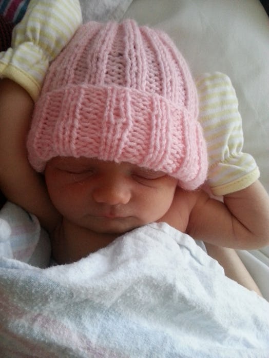 Ceilidhe Wynns' newborn baby with a pink knitted hat