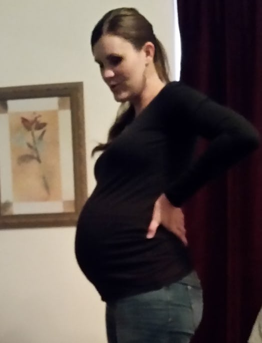 6 weeks pregnant woman standing in the hallway