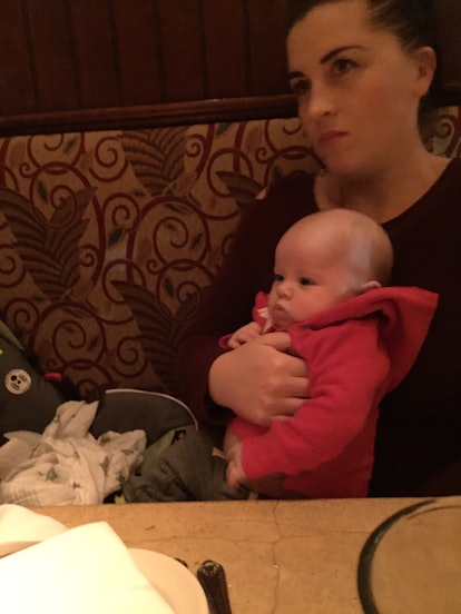 A mother and her kid sitting in the restaurant
