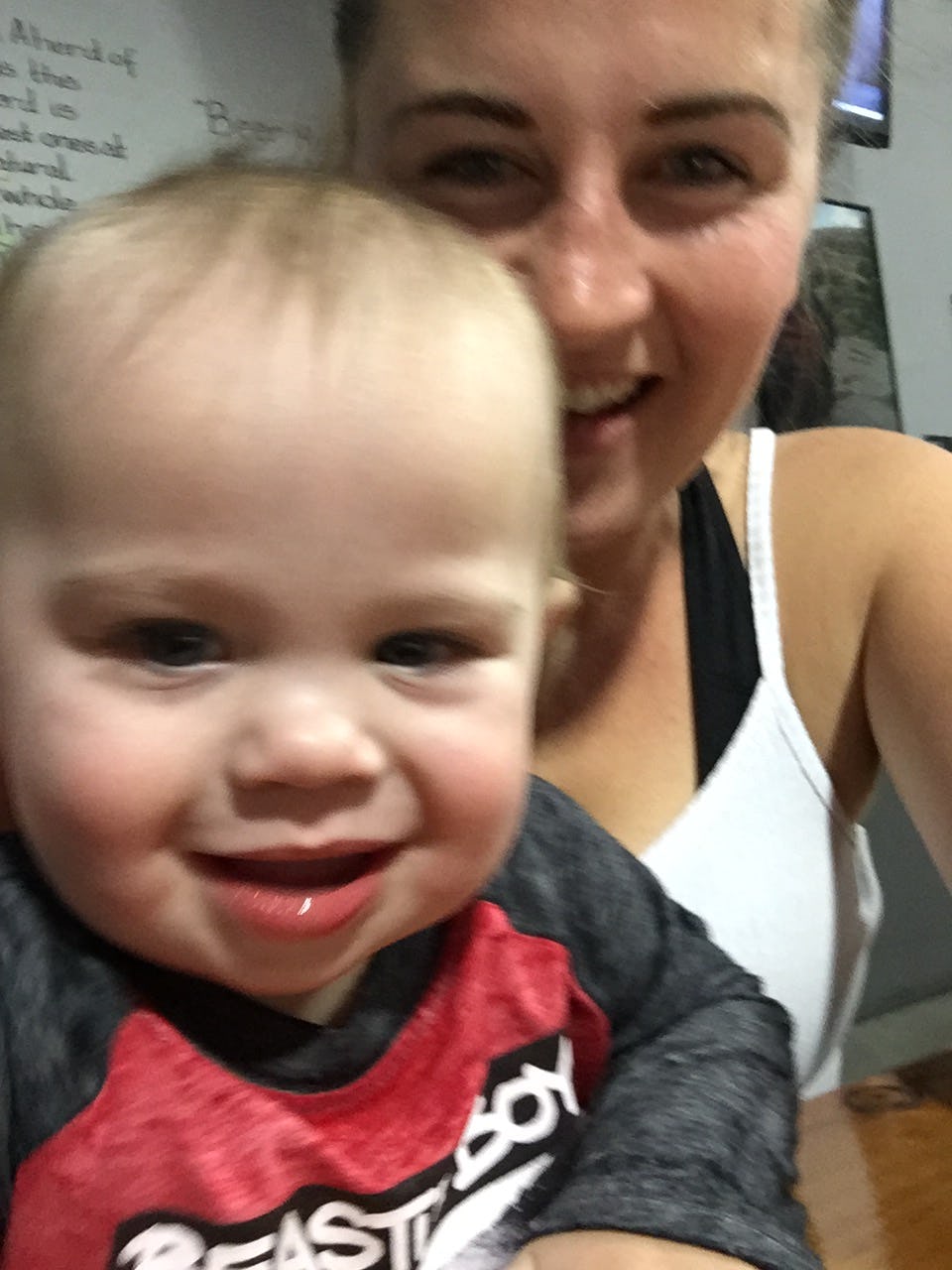 A new mom taking a selfie with her baby son