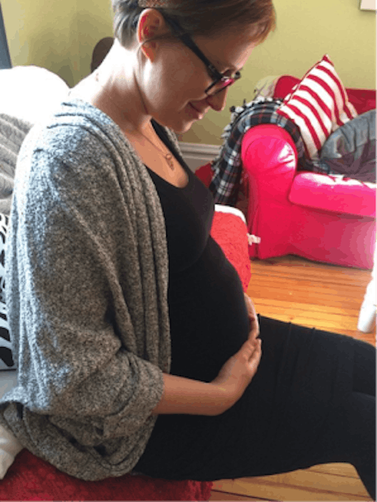 Ceilidhe Wynn holds her pregnant stomach while experiencing Amniocentesis 