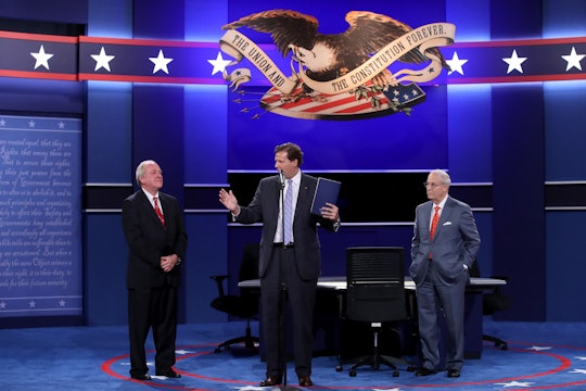 Tim Kaine and Mike Pence along with the host at the Vice Presidential debate