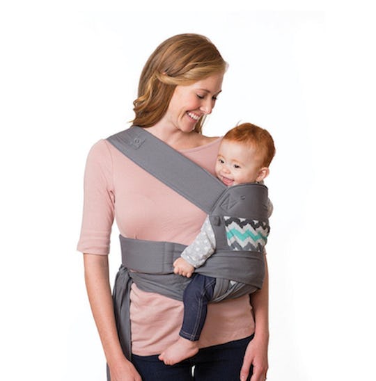 A mom using the Infantino Sash Wrap and Tie Baby Carrier