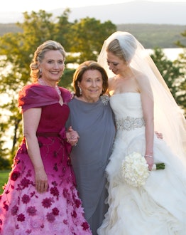 Hillary Clinton at the wedding of her daughter Chelsea Clinton, hugging her daughter and her mother
