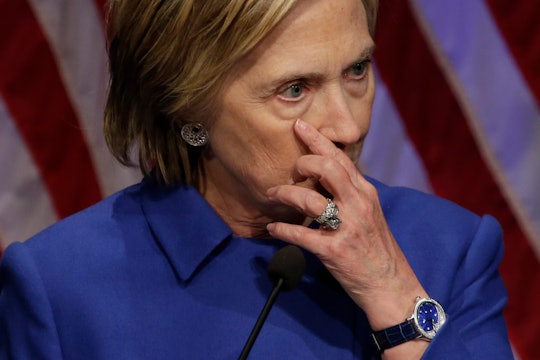Hillary Clinton standing in a blue blazer