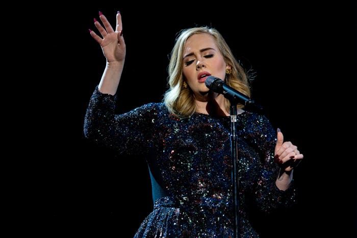 Adele singing during her concert