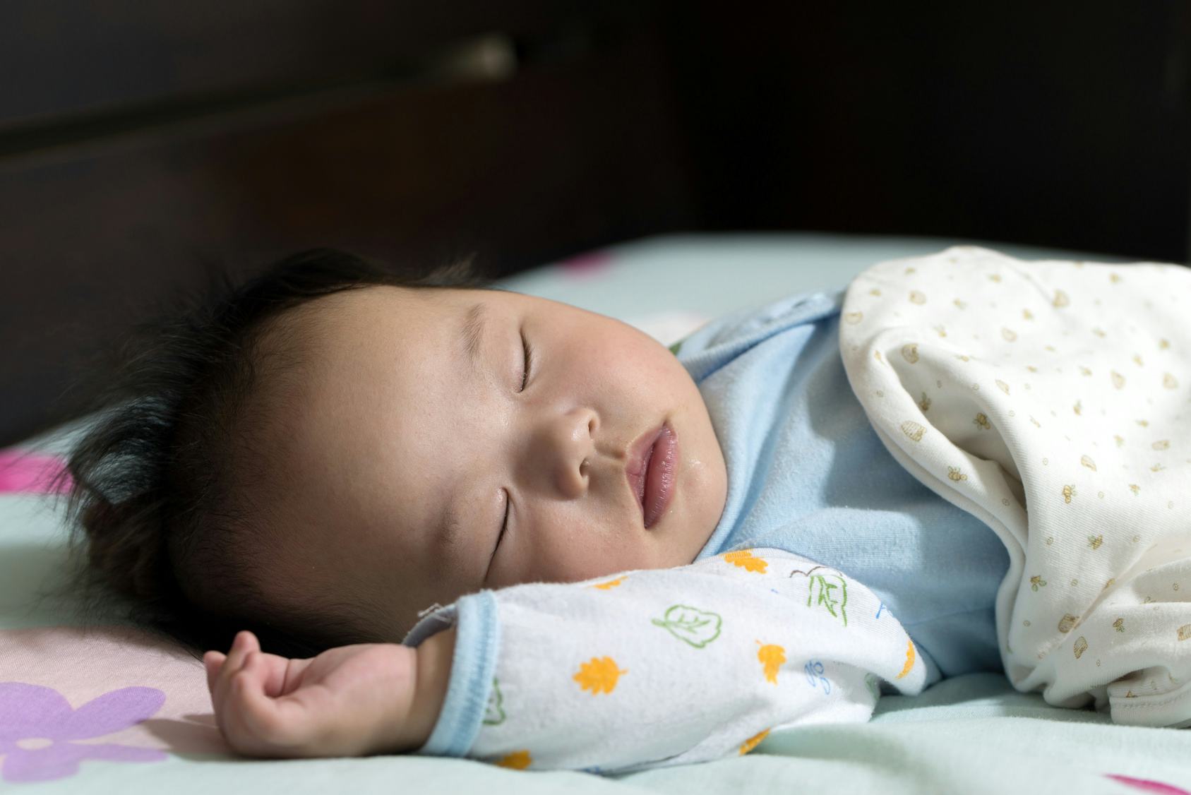 What Every New Mom Needs To Know About A Baby Rolling In Their Sleep