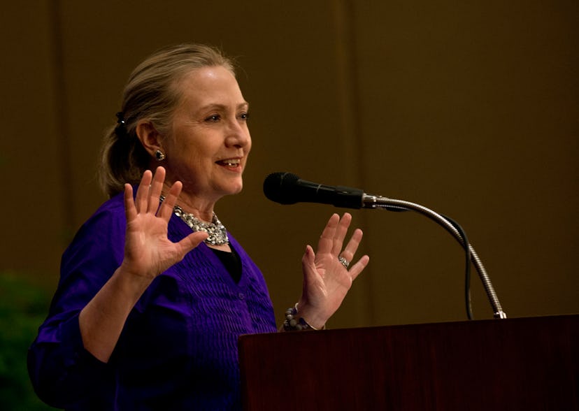 Hillary Clinton giving a speech in a blue blazer