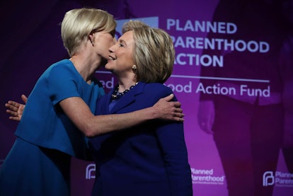 Hillary Clinton hugging with a woman