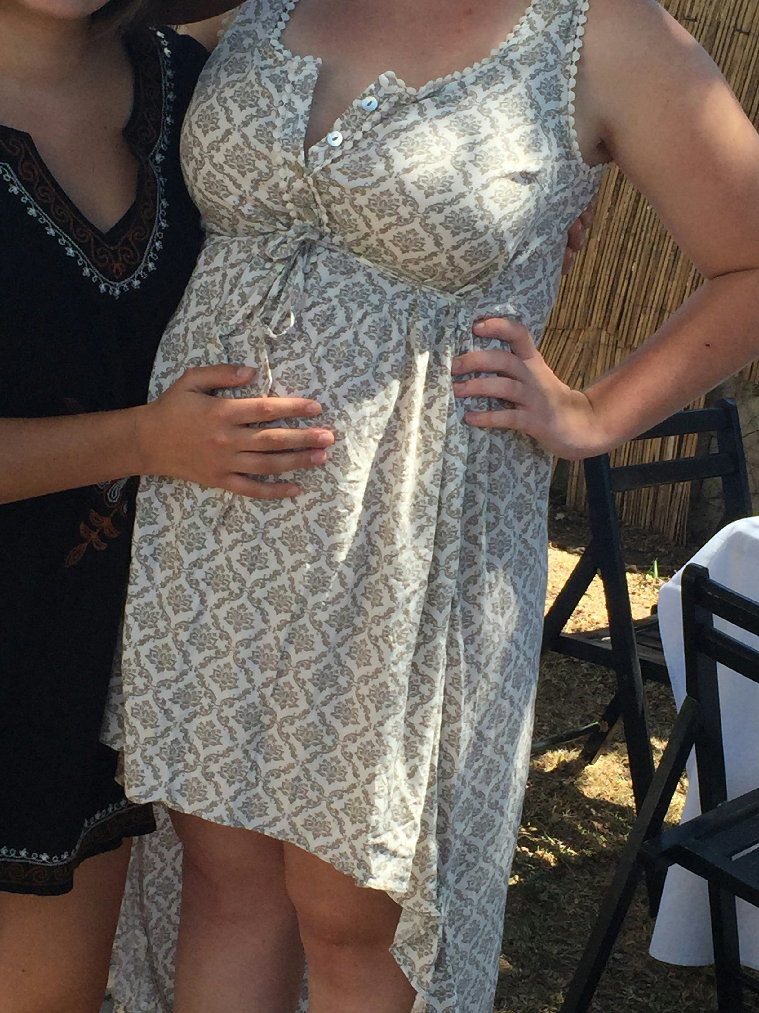 Pregnant woman walking to induce labor