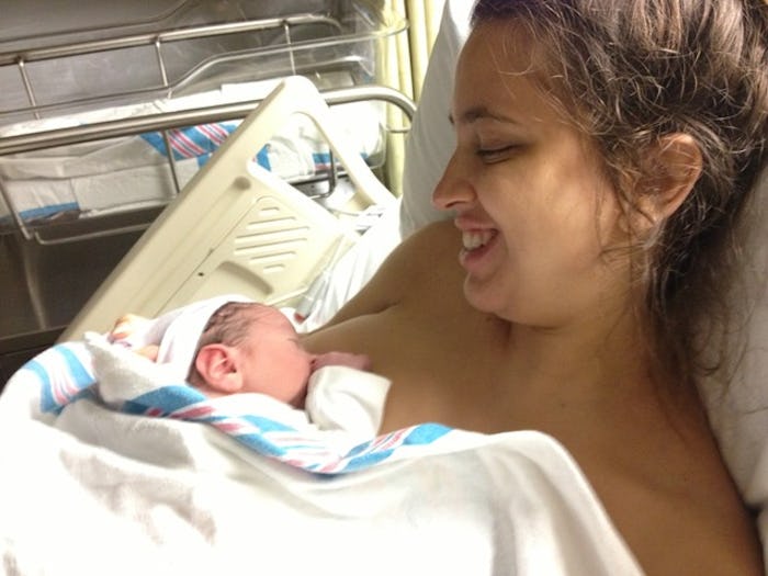 A woman trying to breastfeed her son after labor before putting him up for adoption