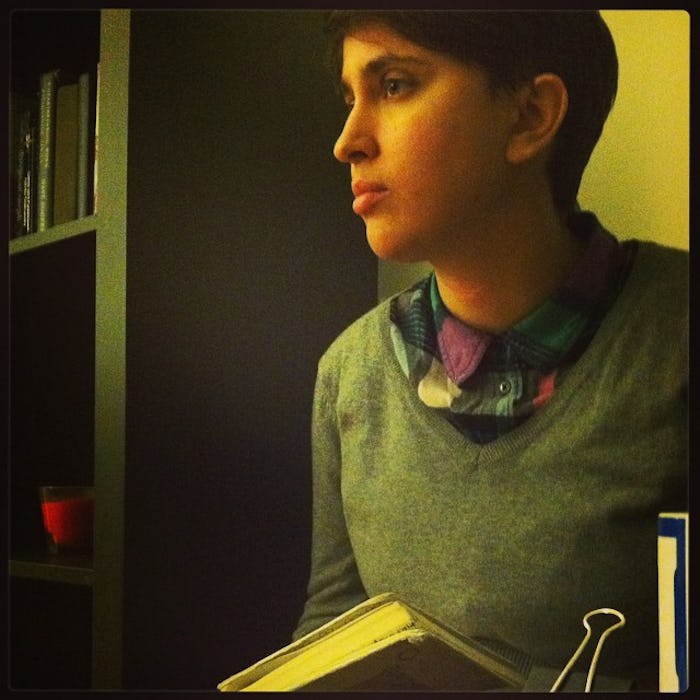 A birth mother holding a book with pregnancy advices