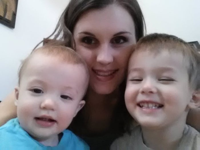 Christi Cazin posing for a selfie with her two sons, all of them smiling at the camera