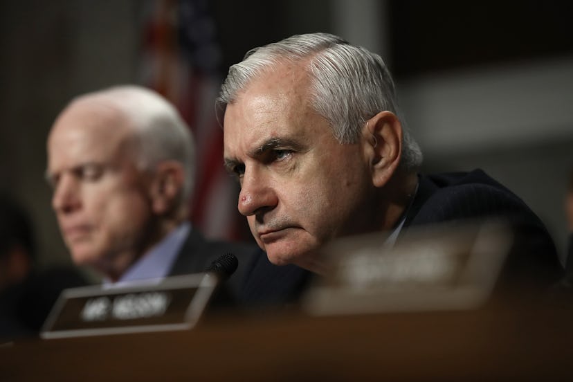 A photo of Sen. Jack Reed sitting and listening to others speaking