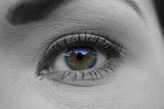 A close up of a woman's eye showing that she experiences blurry vision