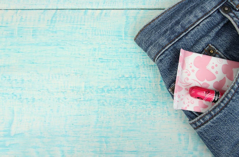 A tampon and a menstrual pad in trouser pants pocket