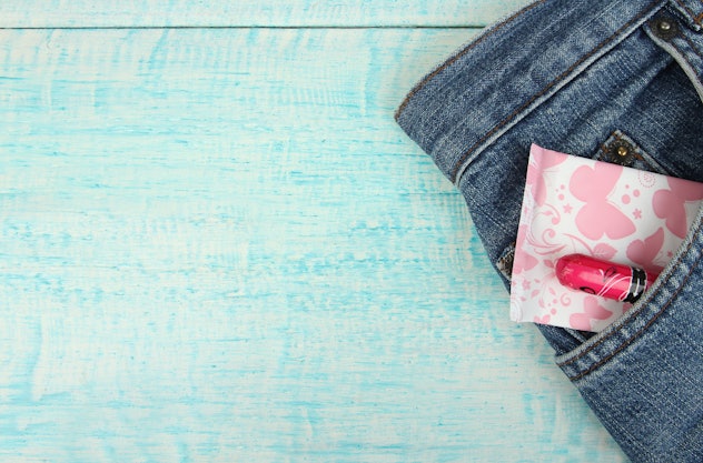 A tampon and a menstrual pad in trouser pants pocket