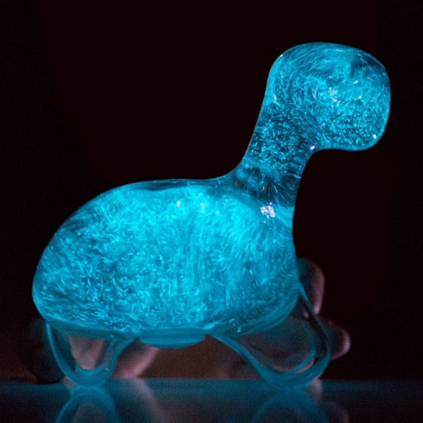 A blue Bioluminescent Dino Pet With Storybook