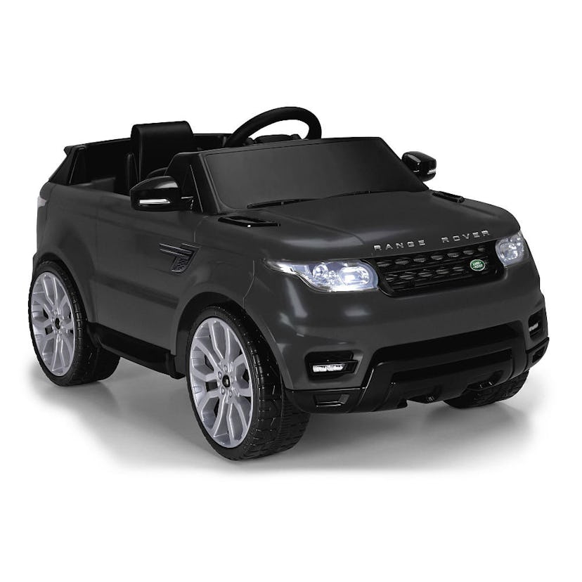 A black range rover car into which kids can sit
