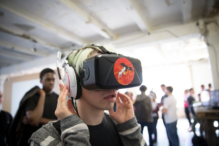A boy having a virtual reality headset on his head