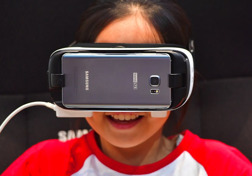 A girl having a virtual reality headset on his head