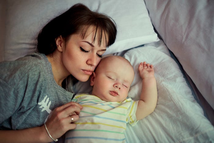 A bed-sharing mom sleeping next to her baby